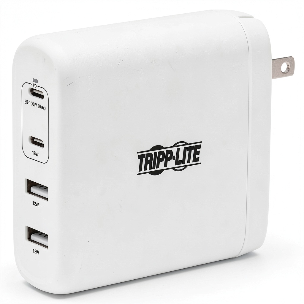 Tripp Lite GaN USB wall charger connected to multiple devices on a desk